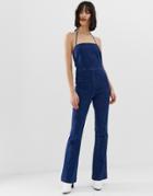 Asos Design Denim Flared Jumpsuit With Strappy Back In Bright Blue