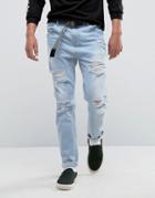 Asos Tapered Jeans In Light Wash Blue With Heavy Rips - Blue