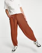 Asos Design Oversized Tapered Smart Pant In Rust Plisse With Elasticized Waist-brown
