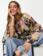 Asos Design Tie Neck Blouse With Flare Sleeve And Tie Wrap Waist In Metallic Floral Print-multi