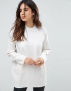 Liquorish Long Turtleneck Sweater With Front Pockets And Lacing Detail On Sleeves - Cream