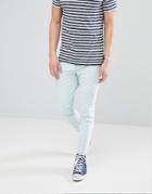 Asos Design Skinny Twisted Seam Jeans In Mid Wash Blue With Raw Hem - Blue