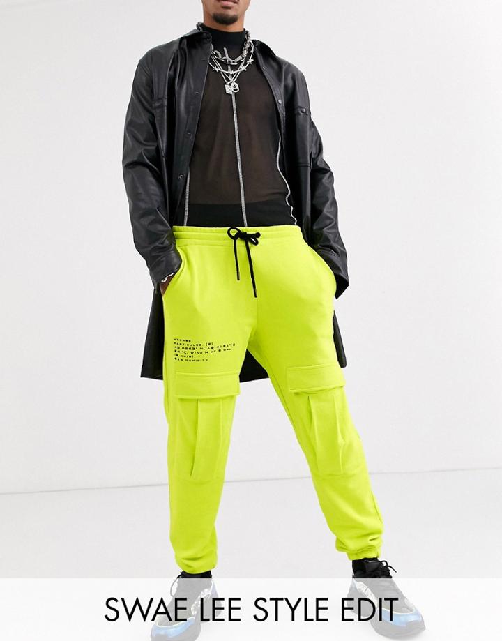 Asos Design Cargo Sweatpants In Washed Neon With Text Print-navy