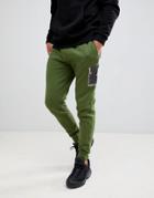 Asos Design Skinny Sweatpants With Camo Panels And Ma1 Pocket - Green