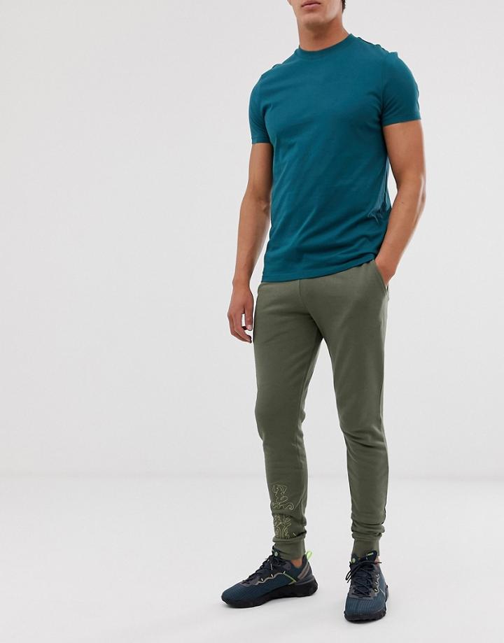 Asos Design Skinny Sweatpants With Embroidered Symbols-green