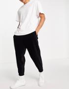 Asos Design Coordinating Oversized Sweatpants In Velour Corduroy-black