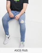 Asos Design Plus Super Skinny Jeans In Light Wash Blue With Knee Rip And Abrasions-blues