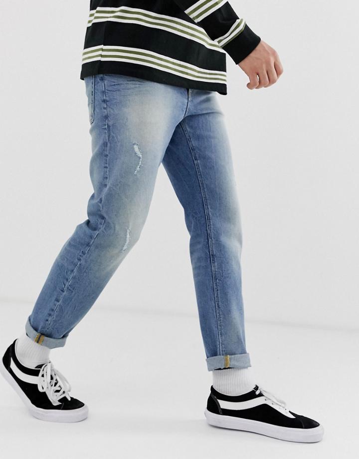 Asos Design Tapered Jeans In Vintage Mid Wash Blue With Abrasions - Blue
