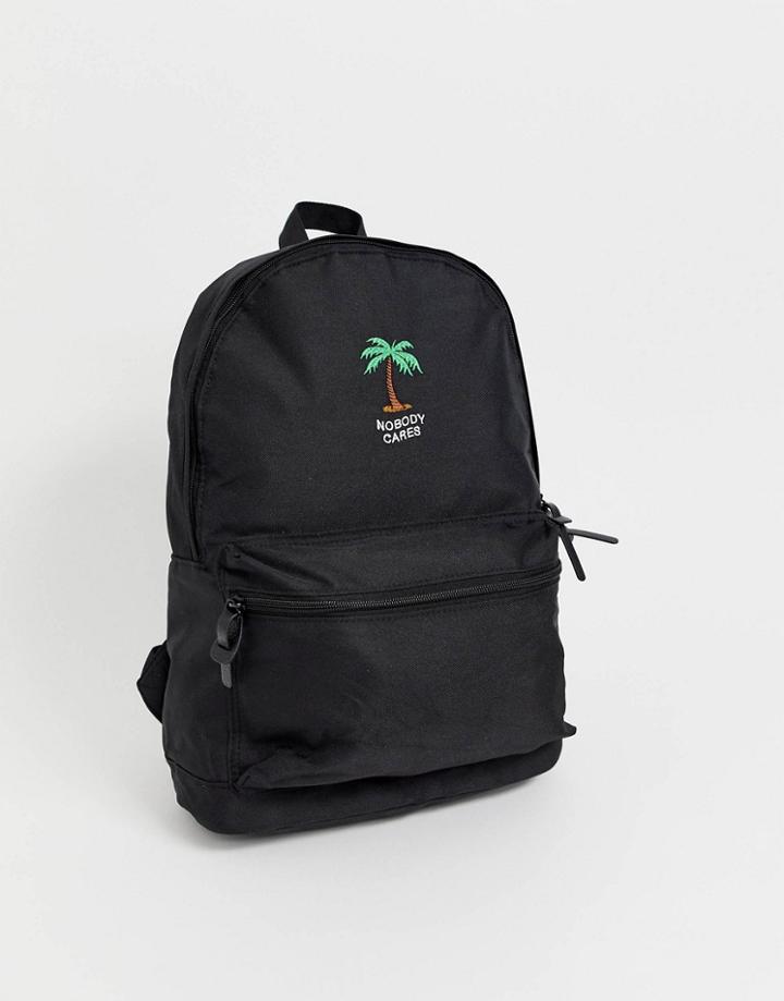 Asos Design Backpack In Black With Nobody Cares Print And Palm Tree