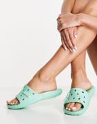 Crocs Classic Slide Flat Sandals In Pistachio-green