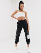 Na-kd Logo Side-stripe Distressed Denim Sweatpants In Washed Black