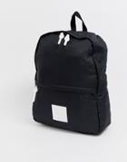 Asos Design Backpack In Black With White Pu Logo Patch
