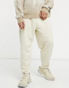 Asos Design Oversized Tapered Sweatpants In Beige-neutral