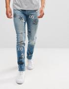 Asos Skinny Jeans In Mid Wash Blue With All Over Doodle Prints - Blue