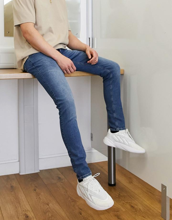 Asos Design Organic Cotton Skinny Jeans In Tinted Dark Wash-blue