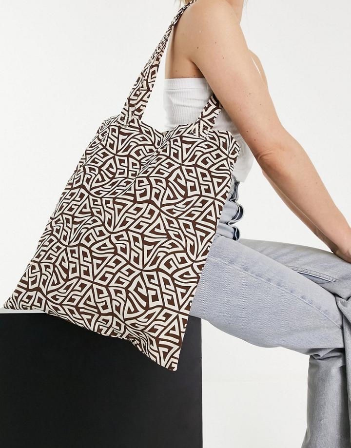 Asos Design Canvas Shopper In Warped Monogram Print-brown