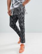 Asos Design Festival Tapered Pants In Black Geo-tribal Print - Black