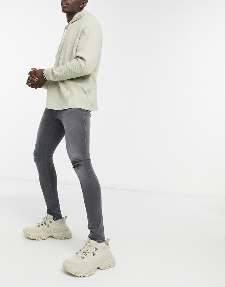 Asos Design Super Skinny Jeans In Washed Black With Knee Rips