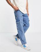 Asos Design Baggy Cargo Jeans In 90s Mid Wash Blue With Pocket Detail