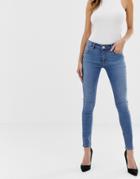 Asos Design Whitby Low Rise Skinny Jeans In Mid Wash Blue - Blue