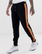 Asos Design Tapered Sweatpants With Neon Reflective Side Stripes In Black - Black