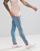 Asos Design Super Skinny Jeans In Light Wash Blue With Abrasions With Geo-tribal Side Stripe - Blue