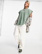 Asos Design Oversized Tank In Green With Dipped Hem And Text Print