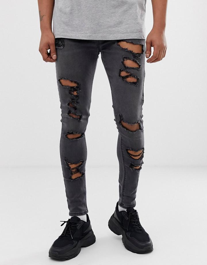 Asos Design Spray On Jeans In Power Stretch With Heavy Rips In Washed Black