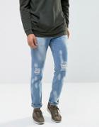 Asos Recycled Denim Slim Jeans In Vintage Light Wash With Bleaching And Rips - Blue
