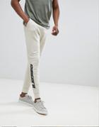 Asos Design Skinny Joggers With Text Print - Beige