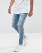 Asos Super Skinny Jeans In Mid Wash Blue With Extreme Rips - Blue