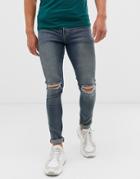 Asos Design 12.5oz Super Skinny Jeans In Mid Wash Blue With Busted Knees And Bum Rip