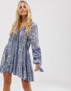 En Creme Swing Dress With Drop Waist And Volume Sleeves In Paisley Print - Blue