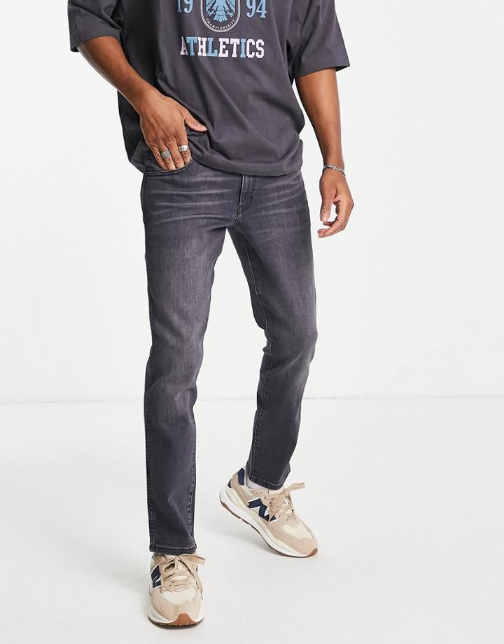 Wrangler Larston Slim Jeans In Washed Black