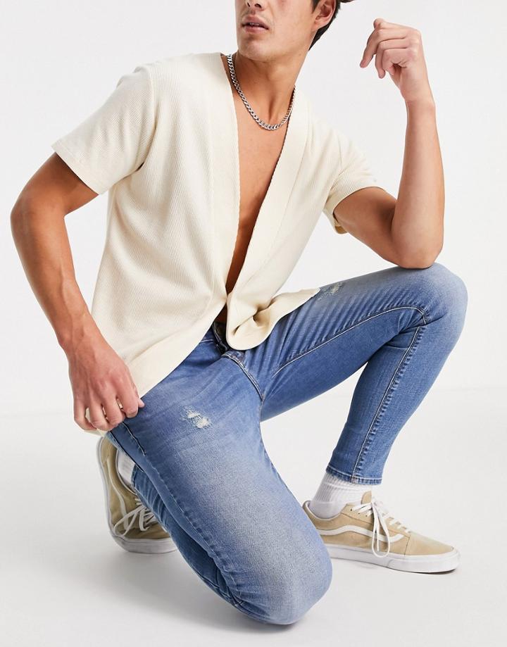 Asos Design Spray On Jeans With Power Stretch In Mid Wash With Abrasions-blues