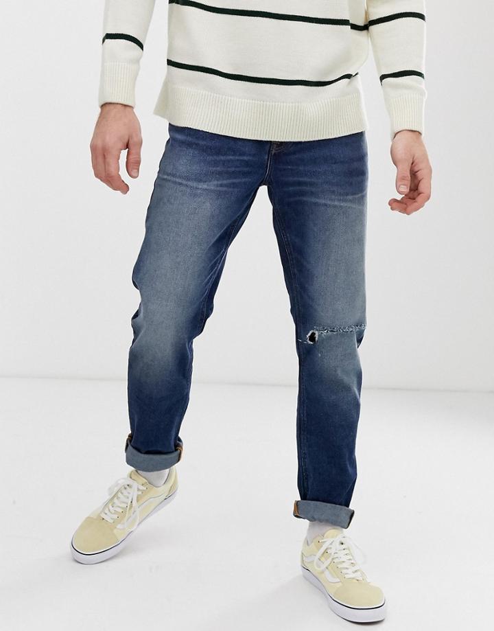 Asos Design Slim Jeans In Dark Wash Blue With Busted Knee Rip