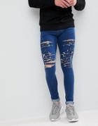 Criminal Damage Muscle Fit Ripped Jeans In Mid Wash - Blue