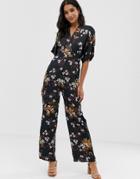 Liquorish Wrap Front Jumpsuit In Floral Print - Black