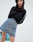 Monki Denim Mini Skirt With Organic Cotton And Button Detail In Mid Blue - Blue