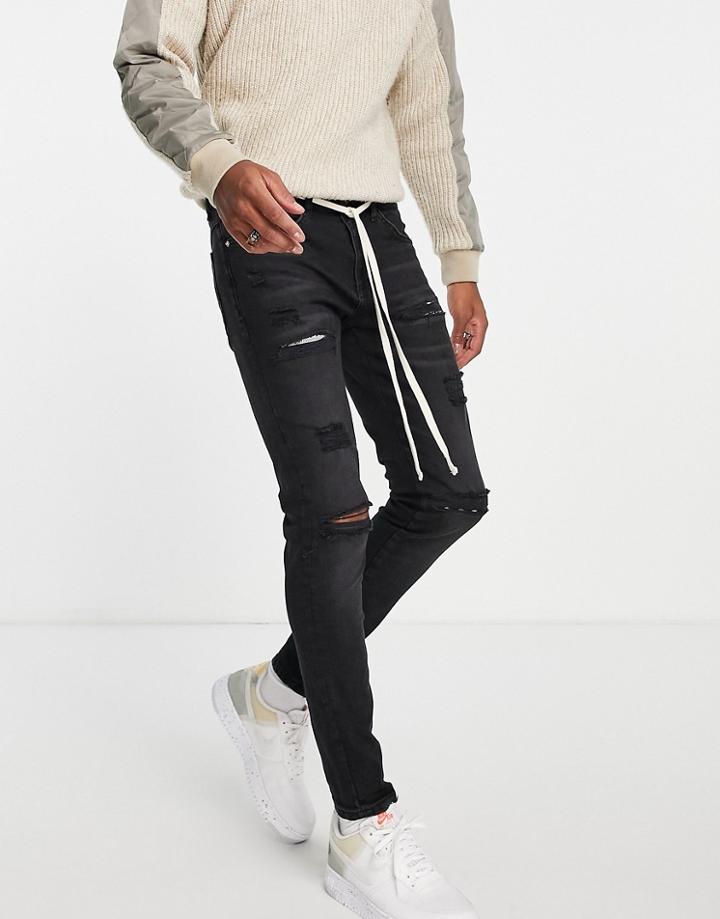 The Couture Club Distressed Slim Jeans In Washed Black With Paisley Inserts