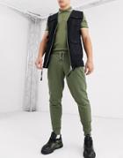 Asos Design Tapered Sweatpants In Khaki With Silver Zip Pockets-green