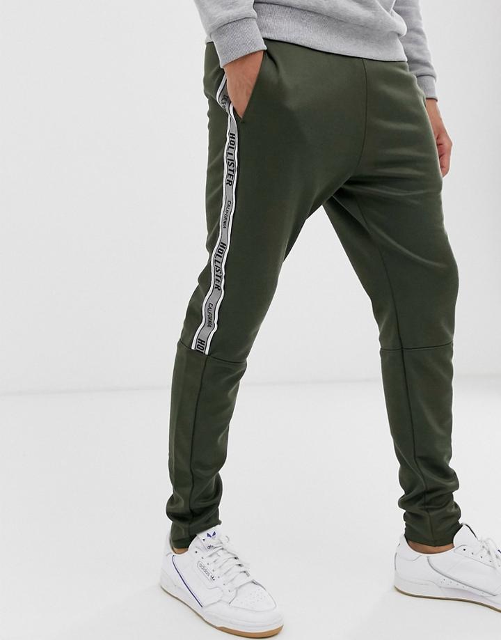 Hollister Leg Logo Side Piping Cuffed Sweatpants In Olive