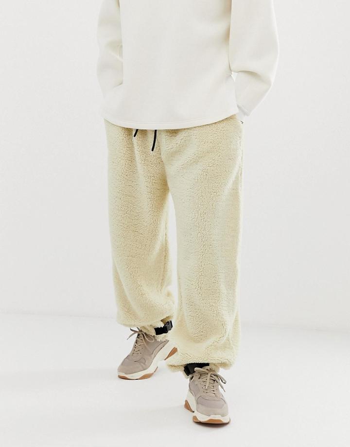 Asos Design Tapered Jogger In Borg With Clip Hem In Beige - Beige