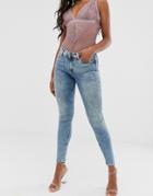 Asos Design Lisbon Mid Rise Skinny Jeans In Mottled Light Wash Blue