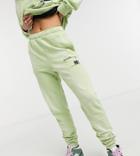 Collusion Text Print Bleached Wash Skinny Sweatpants In Green