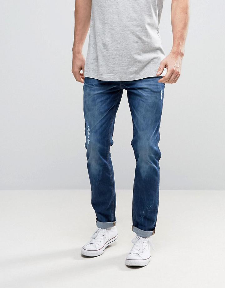 Asos Stretch Slim Low Impact Jeans With Abrasions In Dark Blue - Blue