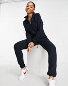 Asos Design Waffle Slouchy Sweatpants Jumpsuit With Pockets In Navy
