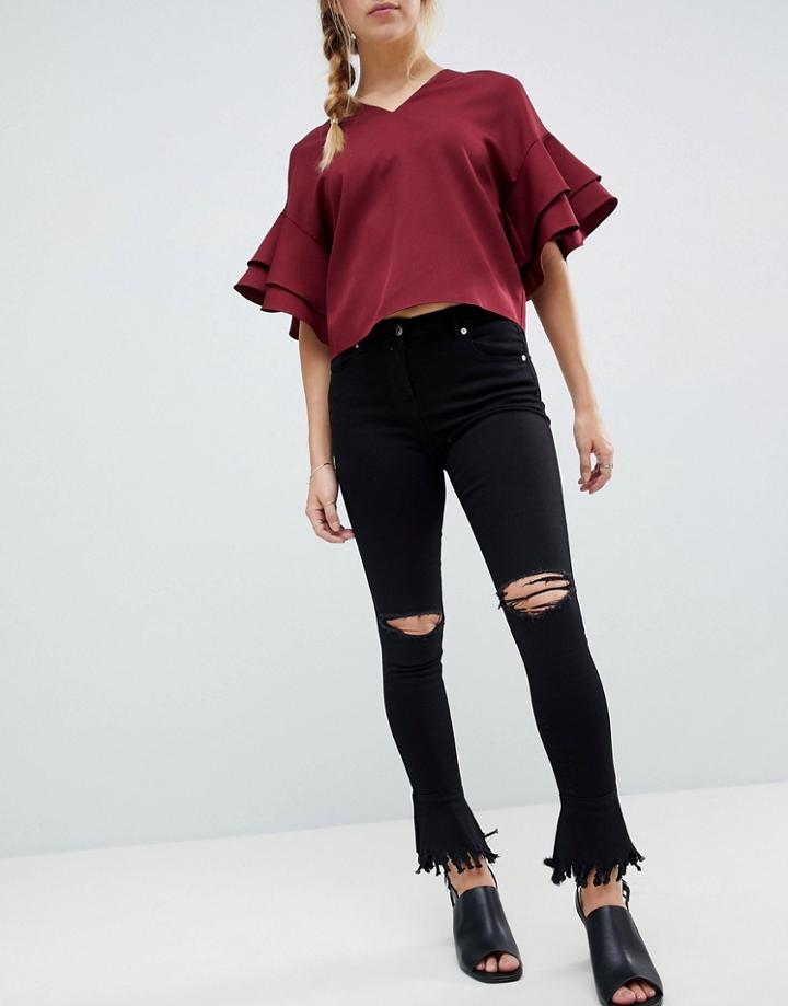 Parisian Skinny Jeans With Knee Rips And Distressed Flare Hem - Black