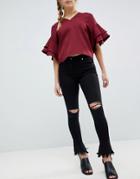 Parisian Skinny Jeans With Knee Rips And Distressed Flare Hem - Black