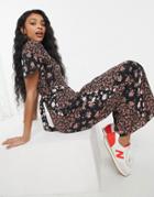 Asos Design Ruffle Sleeve Tie Back Jumpsuit In Mixed Floral Print-multi